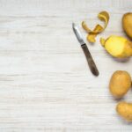 Potatoes and Peeled Potato on Copy space